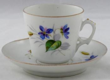 Coffee cup with blue flowers, cob and leaves Coffee cup with blue flowers, cob and leaves