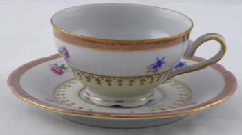 Coffee cup with pink top line and gilded ornament Coffee cup with pink top line and gilded ornament